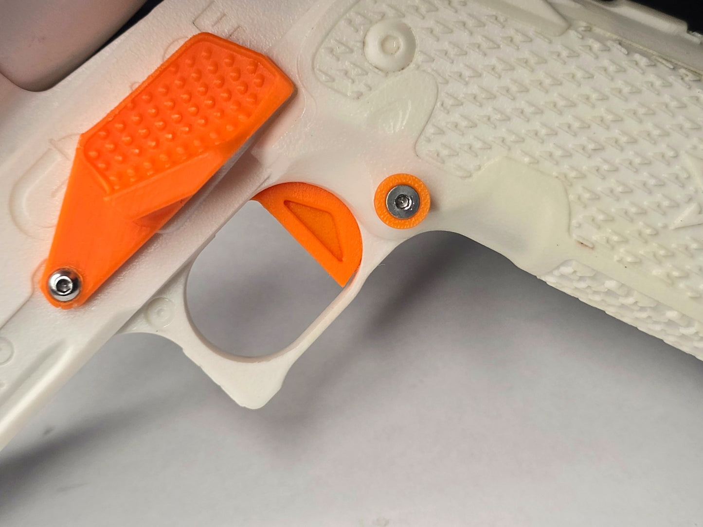 Low profile magazine release button installed on ACE 2011 Staccato P handset